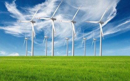 windmills with fresh green grass and beautiful blue sky