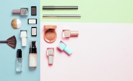 creative flat lay of fashion bright nail polishes and decorative cosmetic on a colorful background. minimal style. copy space. beauty blogger concept. top view.