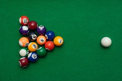 american billiards pool on a green table