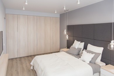 interior of the room in light colors. bedroom with bed and lighting