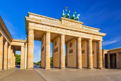 the brandenburg gate in berlin at sunrise, germany