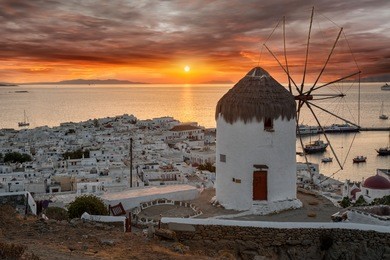 dreamy sunset over mykonos town, cyclades, greece