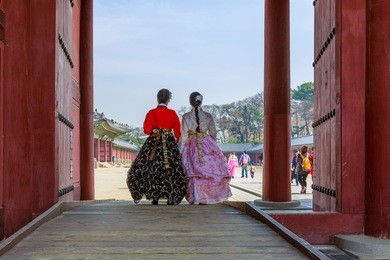 young korean girls dressed hanbok in traditional dress walking in changdeokgung palace, unesco world heritage, seoul, south korea