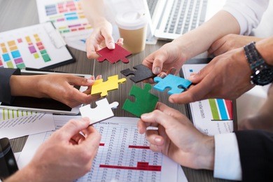 teamwork of partners. concept of integration and startup with puzzle pieces