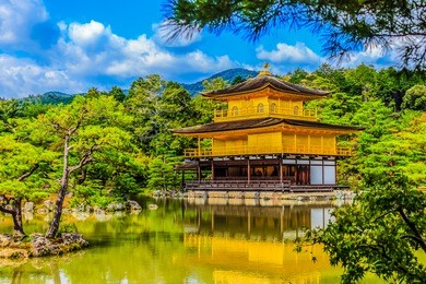 beautiful architecture at kinkaku-ji (temple of the golden pavilion), officially named rokuon-ji (deer garden temple), a zen buddhist temple in kyoto, japan. kinkakuji temple under blue cloudy sky day