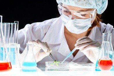 close-up of clinician working with tools during scientific experiment in laboratory
