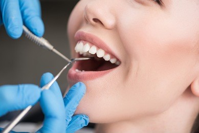 stomatologist taking care of patient oral cavity