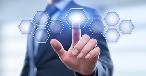 businessman pressing button on virtual screen. man pointing on futuristic interface. innovation technology internet and business concept. space for text. abstract background.