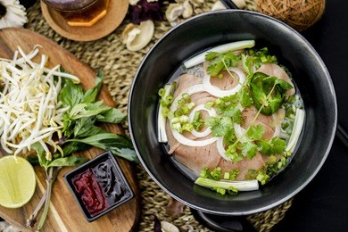 pho is a famous vietnamese traditional food, in which, rice vermicelli served with rare or well done beef and hot tasty soup and fresh vegetable.