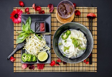 chicken pho is a famous vietnamese traditional food, in which, rice vermicelli served with well done chicken and hot tasty soup and fresh vegetable.