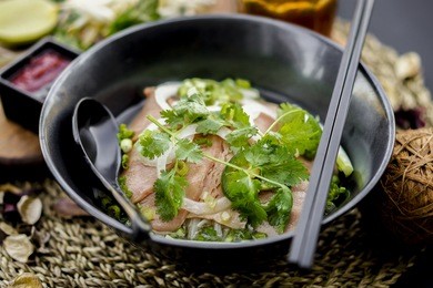 pho is a famous vietnamese traditional food, in which, rice vermicelli served with rare or well done beef and hot tasty soup and fresh vegetable.