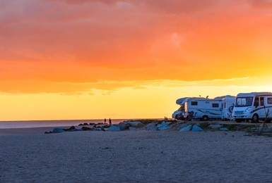 motor homes, camper vans at sunset beach.travel adventure vacation.