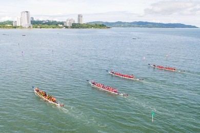 aerial view of a group of dragon boat paddler practice at likas bay sabah malaysia. dragon boat competition is an annual event in sabah malaysia.