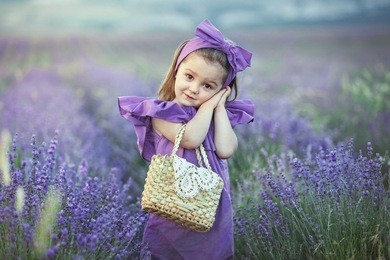 portrait of a pretty toddler girl in lavender field