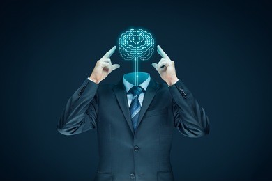 brain with printed circuit board (pcb) design and businessman representing artificial intelligence (ai).