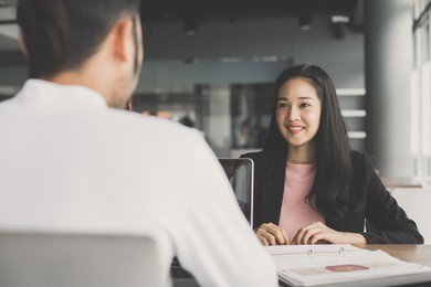 young asian woman working with man at cafe, woman working concept, 20-30 years old, vintage tone.