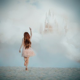 dreamy fine art picture of a girl chasing a castle in the sky. imagination concept