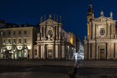 night view of san carlo square with twin churches of san carlo and santa cristina, an example of baroque architecture, turin, italy