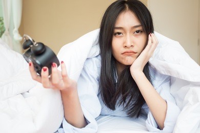 beautiful young girl waking up after a night sleep, waking up for work in morning concept