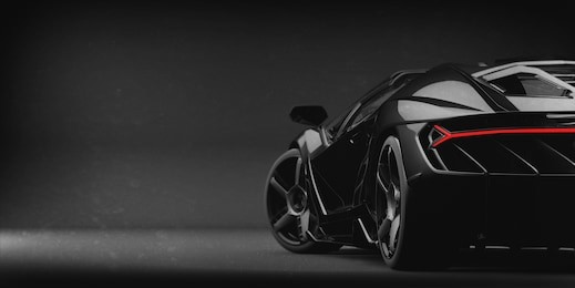 generic black sports car (with grunge overlay), tail lights detail - 3d illustration