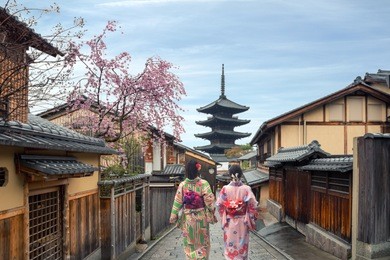couple asian women wearing traditional japanese kimono in yasaka pagoda and sannen zaka street in kyoto, japan.