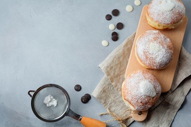 fresh baked berliner with custard on a gray concrete background. german donats. selective focus.top view.