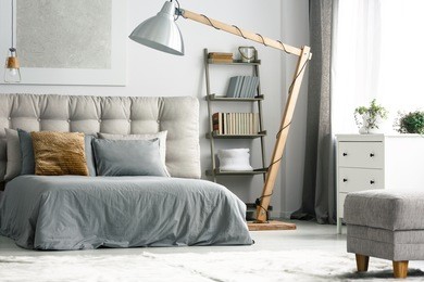 wooden decor in cozy grey bedroom with shelf made of ladder