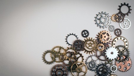 set of rusty metal gears or cogs gear isolated on a white background. closeup of metal cog gears texture pattern decorative frame for connection, innovation and team work concept.