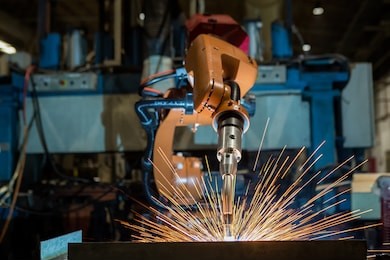 industrial robot is welding test run program in car factory