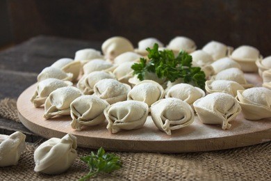raw dumplings on a round board