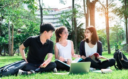 students asian together group teenager studying smile with laptop computer, school folders reading book at high school university campus college knowledge center for learning in summer outdoor.