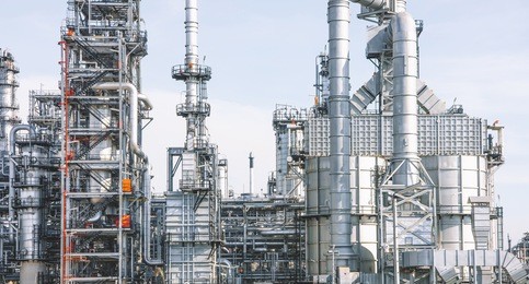 industrial zone,the equipment of oil refining,close-up of industrial pipelines of an oil-refinery plant,detail of oil pipeline with valves in large oil refinery.