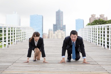 business man and woman  getting ready for race in business