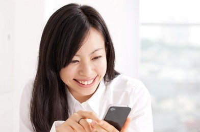 young beautiful girl using mobile phone