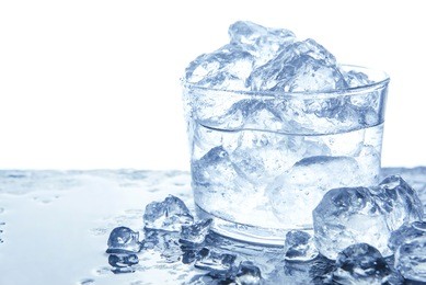 water with ice cubes in glass. isolated on white, copy space