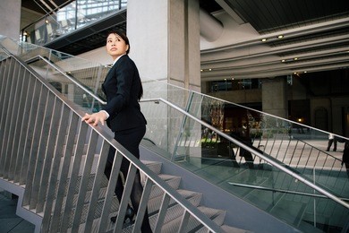 young businesswoman going up the stairs.