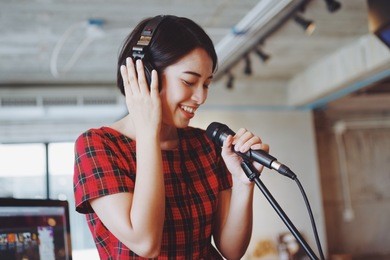 asian beautiful woman singing in studio