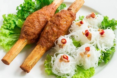 fried shrimp with sugar cane and noodle on top with chili and fried garlic vietnamese food recipe. can use to create menu in the restaurant.