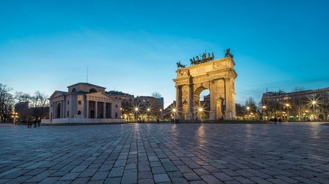 l'arco della pace (the arch of peace) at dusk in milan, italy