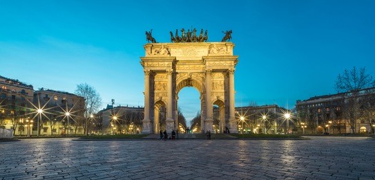 l'arco della pace (the arch of peace) at dusk in milan, italy