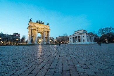 l'arco della pace (the arch of peace) at dusk in milan, italy