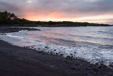 sunrise on a black-sand beach