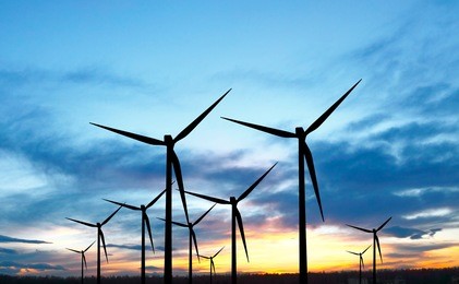 wind turbines at sunset
