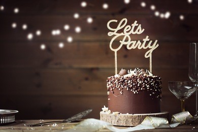 chocolate birthday cake in a party setting