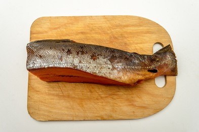 smoked red fish on a cutting board