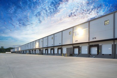 generic white loading docks on industrial building exterior