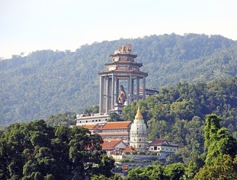 an exotic standing goddess of mercy, kwan yin, statue in the famous kek lok si buddhist temple in the remote area of ayer itam of penang island.