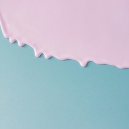 abstract pink oil paint texture on blue canvas. minimalistic background with copy space.