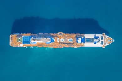 tourist ship in the blue sea, top view