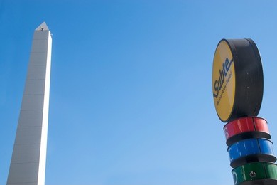 buenos aires obelisk and subway sign. the obelisk of buenos aires is a national historic monument and icon of buenos aires.